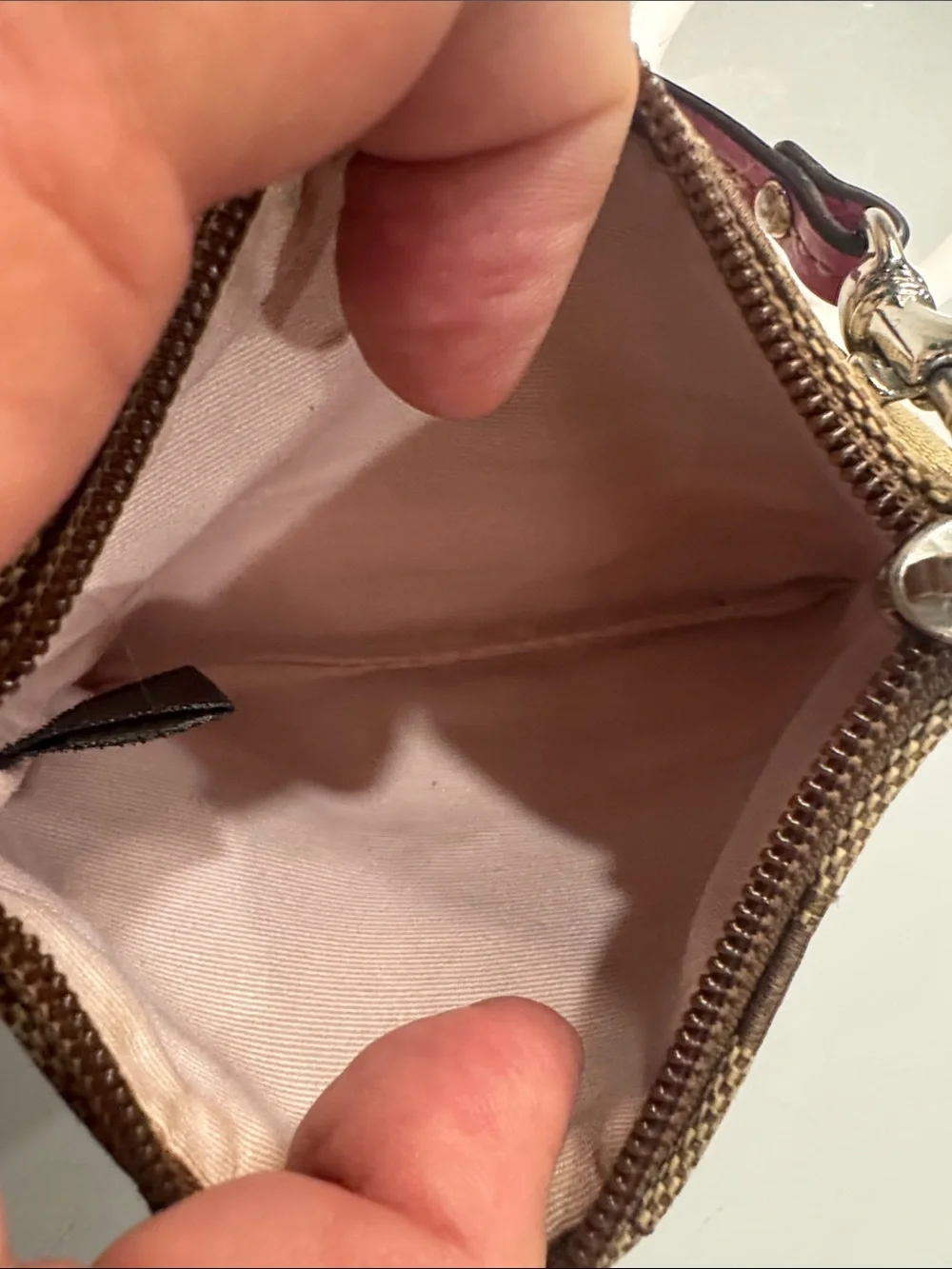 Coach signature wristlet with pink accents and hangtag